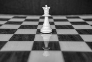 Chess queen on chess board