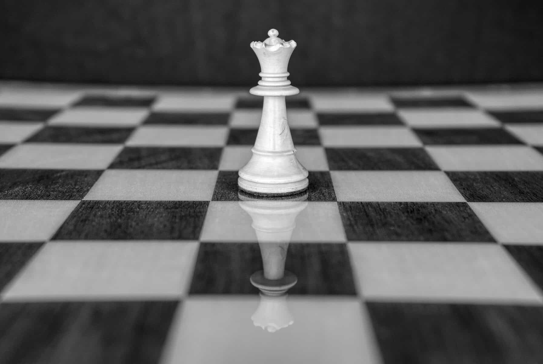 Chess queen on chess board