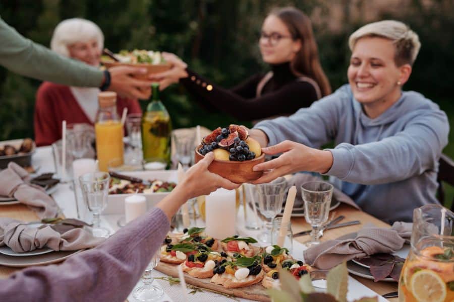 Friends at a Garden Party table sharing food