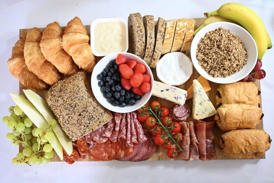 No Cook brunch board with fruit, yoghurt, pastries, bread, meats, cheeses and cereal