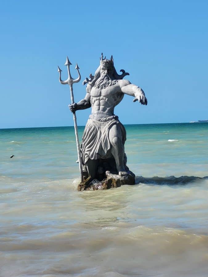 Poseidon statue in the sea